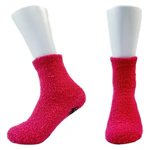 Bright pink coral fleece thickened floor socks featuring non-slip dispensing on sole