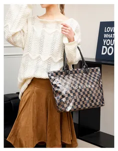 Detailed shot of a vintage checkered tote bag made from clear PVC with large capacity
