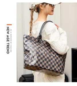 Stylish checkerboard PVC tote bag carried by a model in a white crochet sweater
