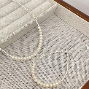Elegant S925 silver and natural pearl necklace and bracelet set with faceted beads