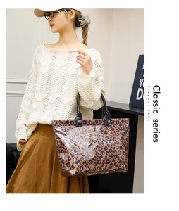 Detailed view of fashionable leopard print tote bag with transparent PVC outer layer