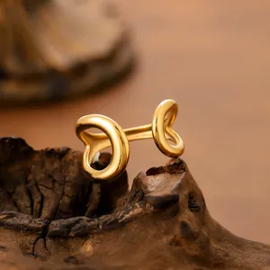 Minimalist golden stainless steel teardrop open ring with a vintage hollow design for women