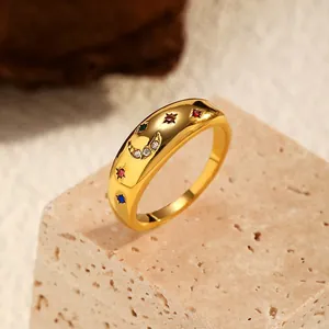 Detailed view of a gold-plated celestial ring with moon and star zircon accents