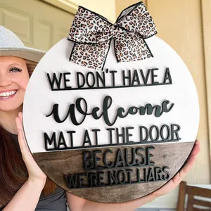 Round rustic wooden door hanger sign with leopard print bow and funny welcome quote