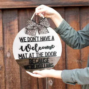 Humorous round wooden door sign decoration with leopard bow and sarcastic quote.