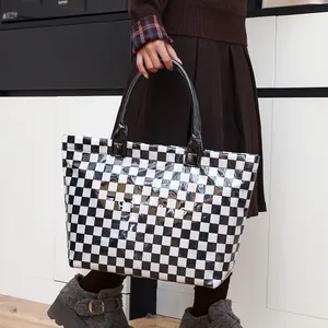 Retro checkerboard PVC tote bag with large capacity for daily commute.