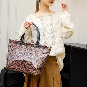 Stylish leopard print PVC tote bag with large capacity for women's daily commute.