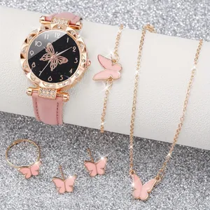 Close-up of pink butterfly watch and rhinestone jewelry set including necklace and ring
