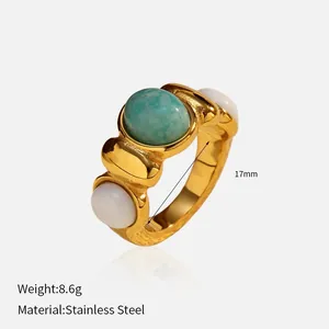 Vintage gold plated stainless steel ring with oval turquoise and white stone inlay
