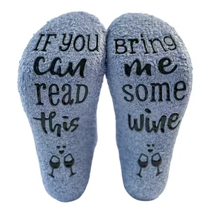 Detail view of thick coral fleece floor socks with funny non-slip wine printing