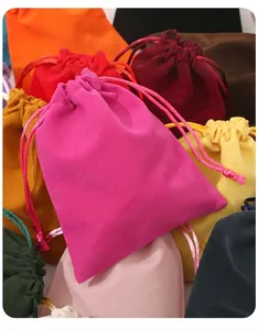 Close-up showing the soft texture and various colors of velvet drawstring storage pouches