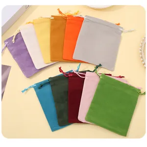 Detailed macro view showing the soft velvet texture and drawstrings of jewelry pouches.