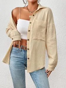 Close-up of a beige drop-shoulder long-sleeve shirt for women with textured gauze fabric