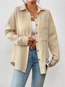 Detail of cream crinkle gauze long sleeve oversized shirt with pocket