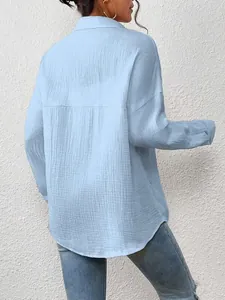 Back view of light blue drop shoulder long-sleeve shirt with crinkle texture