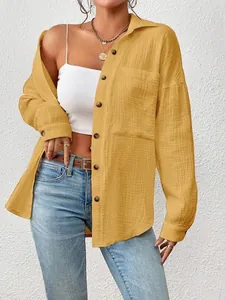 Detail shot of a yellow drop shoulder long sleeve shirt featuring premium textured fabric