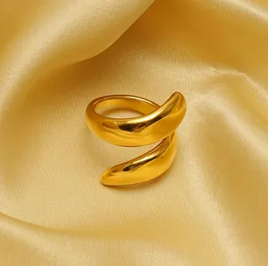 Detailed macro shot of a gold-plated titanium steel ring with smooth mirror finish