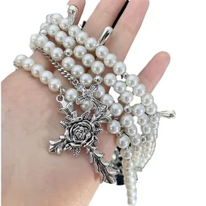 Elegant layered faux pearl choker necklace with ornate silver cross and rose pendant