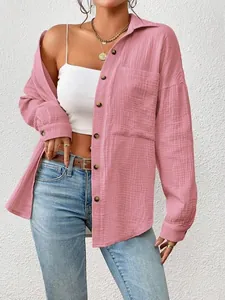Stylish women's pink long sleeve gauze shirt featuring a relaxed drop shoulder design.