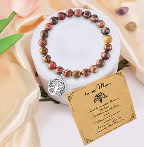 Detail of 8mm natural stone beaded bracelet with tree of life charm and gift card for mom