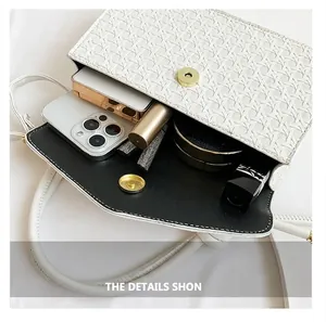 Detailed shot of the white woven bag open showing internal storage for daily items