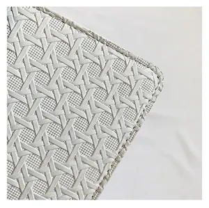 Macro detail of the elegant white woven texture on a retro minimalist square bag
