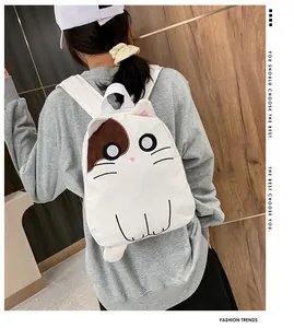 Cute white cat-shaped backpack for girls in Japanese aesthetic style, shown from back.