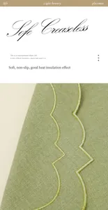 Vue détaillée d'un set de table vert en coton et lin avec bords festonnés brodés