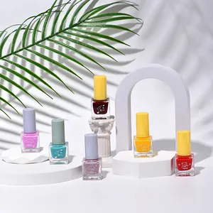 Set of assorted colors quick-dry water-based nail polish on elegant white display stands