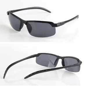 Detail view of stylish men's driving sunglasses in black semi-rimless frame