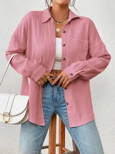 Women's stylish pink long sleeve crinkle button-up shirt with drop shoulder design