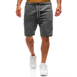 Detail view of men's grey sweat shorts with adjustable drawstring waist and soft fabric.