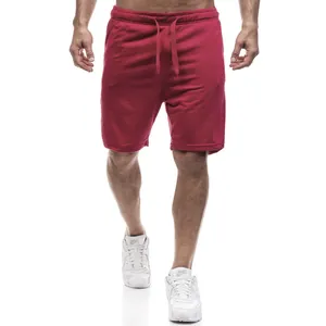 Professional fitness style red solid color casual sports shorts for men with drawstring