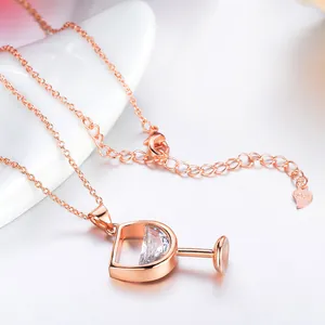 Elegant rose gold wine glass necklace featuring a sparkling half-moon zircon pendant detail