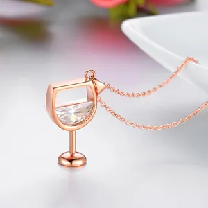 Close-up detail of a rose gold wine glass pendant necklace with sparkling zircon