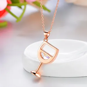 Rose gold wine glass pendant necklace with sparkling crystal detail for parties.