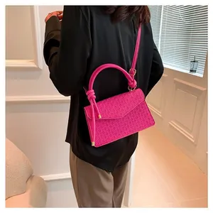 Hot pink textured crossbody bag with unique knot top handle for women