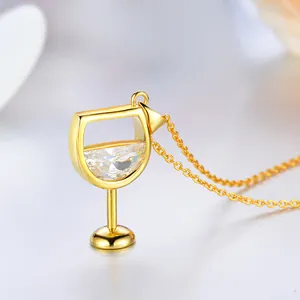Close-up of gold-plated wine glass pendant with sparkling clear zircon detail