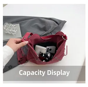 Macro view showing the spacious internal capacity of the vintage fringe tassel tote bag