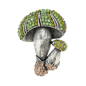 Vintage mushroom brooch with sparkling green rhinestones and antique silver-tone finish