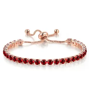 Detail view of rose gold adjustable bracelet with 4mm red round cubic zirconia