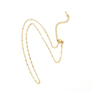 Gold stainless steel lip chain necklace showing lobster clasp and extender detail.