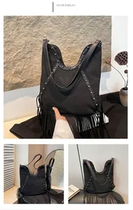 Bohemian black fringe tote bag featuring silver studs and a sun embossing design