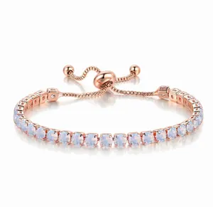 Close-up detail of 4mm round white zircon stones on a rose gold adjustable tennis bracelet