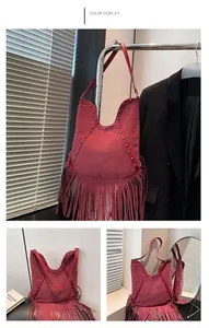 Red Bohemian retro tassel shoulder bag with rivets and sun embossing pattern detail