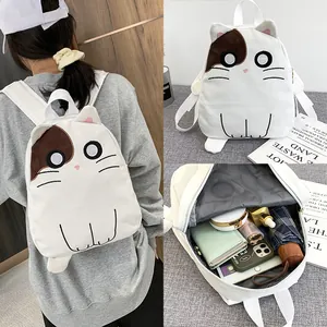 Detailed view of a cute white cat canvas backpack showing its spacious interior capacity