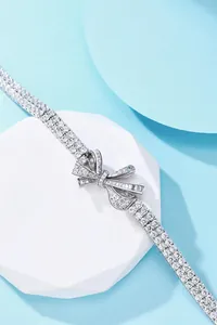 Elegant S925 silver ribbon bow bracelet set with sparkling cubic zirconia crystals