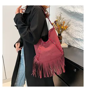 Vintage Bohemian style hobo bag with long wine red fringes and sun embossing detail