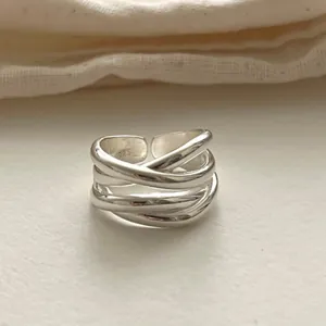 High-quality detailed macro view of 925 sterling silver irregular multilayer cross ring