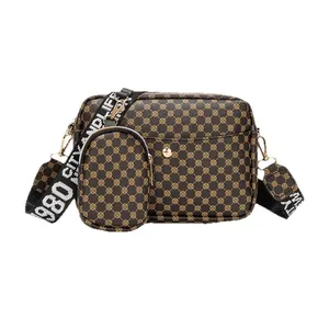 Stylish brown monogram 2-piece crossbody bag set with wide '1980 City Life' strap
